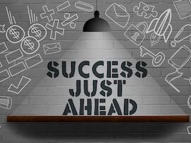 success-just-ahead-word-business-concept-with-lamp-wall_698953-11105